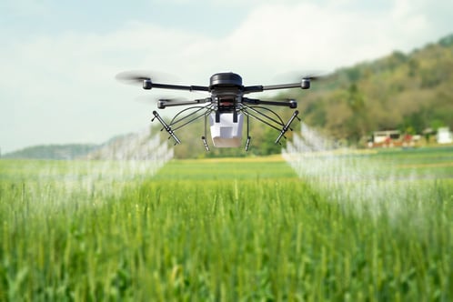 drone-spraying-pesticide-wheat-field-scaled